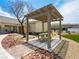 Community picnic area includes a covered table, landscaping, and surrounding residences at 4563 Townwall St, Las Vegas, NV 89115
