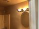 Bathroom featuring an oval mirror and updated lighting at 4704 Wild Oak Way, North Las Vegas, NV 89031