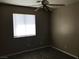 Bedroom with neutral walls and a window with blinds for privacy at 4704 Wild Oak Way, North Las Vegas, NV 89031