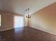 Bright dining room features a chandelier and sliding glass door providing ample natural light at 4704 Wild Oak Way, North Las Vegas, NV 89031