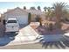 Charming single-story home with desert landscaping, mature palms, and a two-car garage at 4704 Wild Oak Way, North Las Vegas, NV 89031