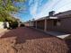 Backyard featuring desert landscaping, including a rock lawn and privacy wall at 4704 Wild Oak Way, North Las Vegas, NV 89031