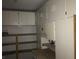 Attached garage with storage cabinets and shelves at 4704 Wild Oak Way, North Las Vegas, NV 89031