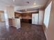 Open kitchen featuring matching appliances, ample countertop space, and tile flooring at 4704 Wild Oak Way, North Las Vegas, NV 89031