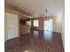 Open-concept living and dining area with tile floors and lots of natural light at 4704 Wild Oak Way, North Las Vegas, NV 89031