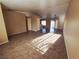 Bright and spacious living room featuring tile floors and neutral paint scheme at 4704 Wild Oak Way, North Las Vegas, NV 89031