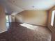 Spacious living room with tile flooring and natural light through sliding glass door at 4704 Wild Oak Way, North Las Vegas, NV 89031