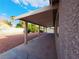 Covered patio looking out to the backyard, including rock lawn and desert landscaping at 4704 Wild Oak Way, North Las Vegas, NV 89031