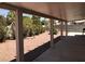 Covered patio overlooks a private backyard with desert landscaping at 4704 Wild Oak Way, North Las Vegas, NV 89031