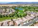 This aerial shows a residential area near a golf course and water, offering a scenic view at 5235 E La Campana Dr, Pahrump, NV 89061
