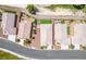 An aerial view shows houses, roads, and golf course with some of the homes having putting greens in the backyard at 5235 E La Campana Dr, Pahrump, NV 89061