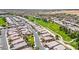 Aerial view of a desert community next to a lush green golf course and winding road at 5235 E La Campana Dr, Pahrump, NV 89061
