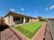 A cozy backyard with pavers and artificial grass, perfect for outdoor relaxation and entertaining at 5235 E La Campana Dr, Pahrump, NV 89061