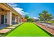 Backyard boasts a synthetic lawn and easy access to the putting green at 5235 E La Campana Dr, Pahrump, NV 89061