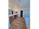 Wood-look floors and double sinks accent this bathroom with a shower and tub at 5235 E La Campana Dr, Pahrump, NV 89061