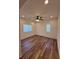Bedroom features wood-look floors, recessed lights and two windows at 5235 E La Campana Dr, Pahrump, NV 89061