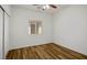 Small bedroom featuring wood flooring, and a window at 5235 E La Campana Dr, Pahrump, NV 89061