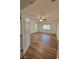 Bright, airy bedroom with wood-look floors, ceiling fan, and plenty of natural light at 5235 E La Campana Dr, Pahrump, NV 89061