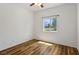 Cozy bedroom with hardwood floors and bright window views at 5235 E La Campana Dr, Pahrump, NV 89061