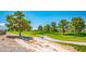 Picturesque view of the community green space with mature trees and walking paths at 5235 E La Campana Dr, Pahrump, NV 89061
