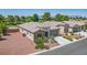 This single-story home boasts desert landscaping, a stone facade, and an attached two-car garage at 5235 E La Campana Dr, Pahrump, NV 89061