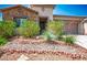 Charming single-story home with stone accents and desert landscaping at 5235 E La Campana Dr, Pahrump, NV 89061
