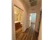 Hallway leading to a bathroom and bedroom, featuring wood-look floors at 5235 E La Campana Dr, Pahrump, NV 89061