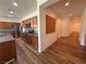 Open-concept kitchen with stainless steel appliances, granite countertops, and modern cabinetry at 5235 E La Campana Dr, Pahrump, NV 89061