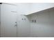 Utility room or mud room with shelving, coat hooks, and access to the garage at 5235 E La Campana Dr, Pahrump, NV 89061