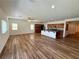 Bright and airy open-concept living space featuring wood-look floors and recessed lighting at 5235 E La Campana Dr, Pahrump, NV 89061