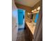 Bathroom with a vanity, mirror, and view into another room at 5517 Rock Creek Ln, Las Vegas, NV 89130