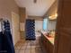 Bathroom featuring double sinks, vanity, shower and bath at 5517 Rock Creek Ln, Las Vegas, NV 89130