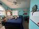 Brightly colored bedroom with a bed, vanity, and decor at 5517 Rock Creek Ln, Las Vegas, NV 89130
