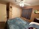 Bedroom featuring ceiling fan, closet with sliding doors, and neutral-toned walls at 5517 Rock Creek Ln, Las Vegas, NV 89130
