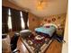 Bright bedroom features a comfy bed, a ceiling fan, and a cozy rug at 5517 Rock Creek Ln, Las Vegas, NV 89130