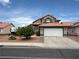 Charming two-story home with a well-maintained front yard and a spacious two-car garage at 5517 Rock Creek Ln, Las Vegas, NV 89130