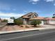 Charming home featuring desert landscaping, a multi-car garage, and RV parking on a sunny day at 5517 Rock Creek Ln, Las Vegas, NV 89130