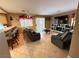 Cozy living room featuring comfortable seating, a TV, and access to the backyard at 5517 Rock Creek Ln, Las Vegas, NV 89130