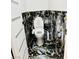 Close-up of a modern toilet with bidet features in a stylish bathroom with black and gold tiling at 5568 Yellow Ash St, Las Vegas, NV 89118