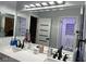 Bright bathroom featuring double sinks, sleek countertops, and a modern design at 5568 Yellow Ash St, Las Vegas, NV 89118