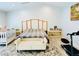 A main bedroom featuring a bed, rug, bench and a crib perfect for relaxation and Gathering time at 5568 Yellow Ash St, Las Vegas, NV 89118
