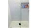 Walk-in shower featuring rain-drop like tile accents and a mosaic tile floor at 5568 Yellow Ash St, Las Vegas, NV 89118