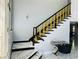 Stylish staircase with black and gold accents, complemented by marble floors at 5568 Yellow Ash St, Las Vegas, NV 89118