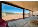 Backyard featuring a covered patio with concrete flooring and a spacious, low-maintenance gravel yard at 5730 Coleman St, North Las Vegas, NV 89031
