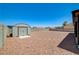Spacious backyard with rock landscaping and a convenient storage shed at 5730 Coleman St, North Las Vegas, NV 89031