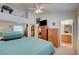 Spacious bedroom with a bed, dresser, and ensuite bathroom, offering ample storage at 5730 Coleman St, North Las Vegas, NV 89031