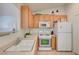 Functional kitchen with bright cabinets and essential appliances, perfect for home cooking at 5730 Coleman St, North Las Vegas, NV 89031