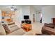 Open-concept living room with tile flooring, ceiling fan, and neutral color palette at 5730 Coleman St, North Las Vegas, NV 89031