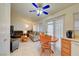 Open floor plan with a dining area leading to a living room with a fan and natural light at 5730 Coleman St, North Las Vegas, NV 89031