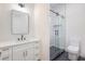 Modern bathroom with black fixtures, sleek vanity, framed mirror, and glass-enclosed shower at 605 Canyon Greens Drive Dr, Las Vegas, NV 89144